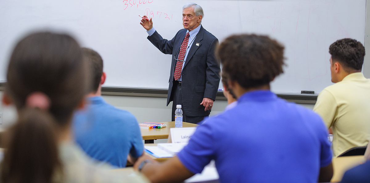 Dr Glenn Sumners speaking to a group of people.