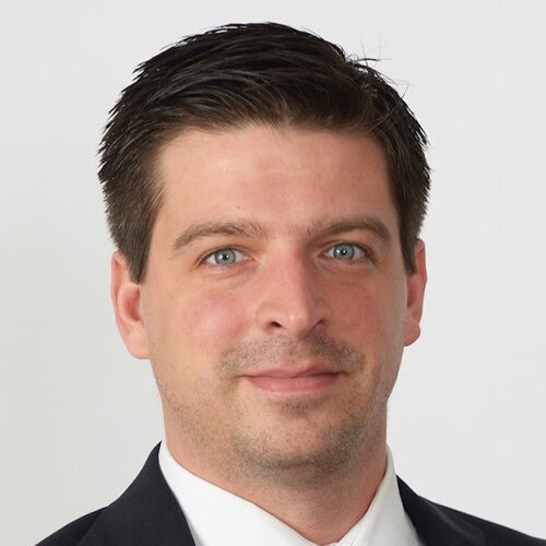 Nikolaos Artavanis headshot wearing a suit jacket