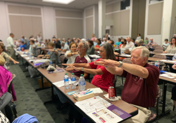 Louisiana Parkinson's Conference attendees doing movement exercise.