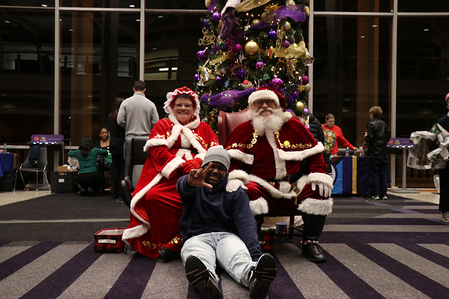 student with Santa and Mrs. Claus