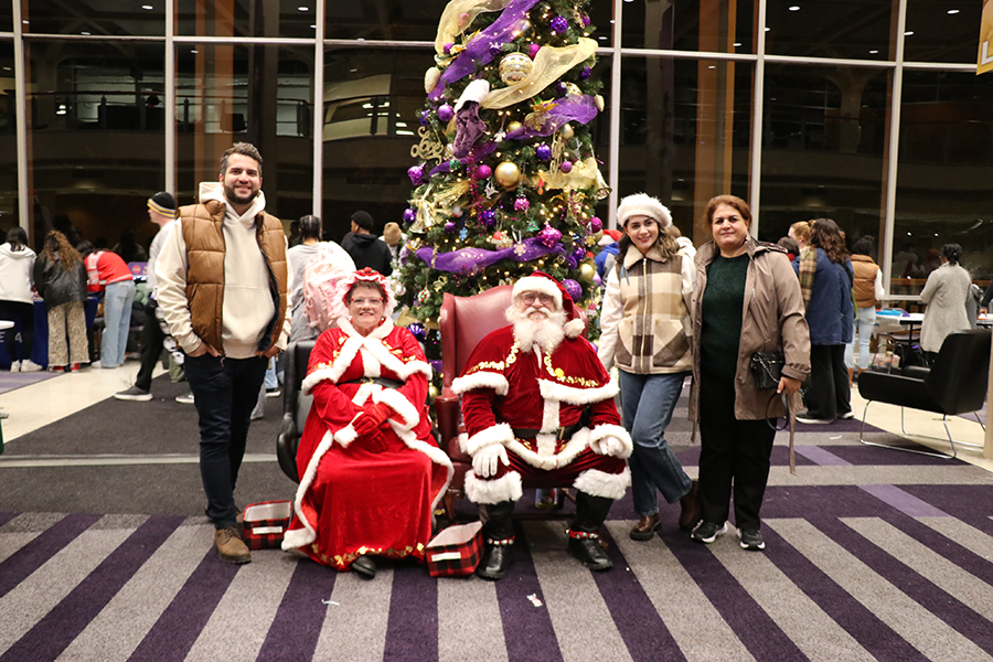 family with Santa and Mrs. Claus